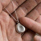 Worry bean pendant